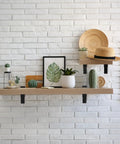 Tough As Nails Heavy Duty Floating Shelf Brackets Set Of Four adjusts securely to glass or wood with a stylish display of plants.