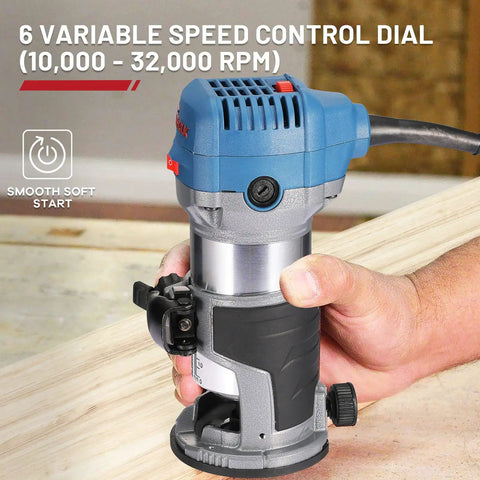 Hand holding Compact Wood Router Kit With 6.5 Amp 1.25 HP Power 32000 RPM Handy Beginner Friendly DIY Trim Router indoors.