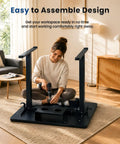 Woman assembling ExaDesk 35 By 20 Inch Electric Standing Desk Compact Height Adjustable Sit Stand Workstation in black.