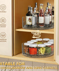 Clear Rectangular Lazy Susan Organizer For Refrigerator 13.5 By 8.5 Inches with condiments and bottles on cabinet shelf.