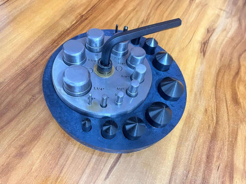 Round Disc Cutter Set With Ten Hardened Steel Punches And Dies Rubber Base Circle Cutter For Jewelry Making on wooden surface