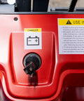 Close-up of Heavy Duty Fully Electric Adjustable Straddle Stacker charger port with warning sticker.
