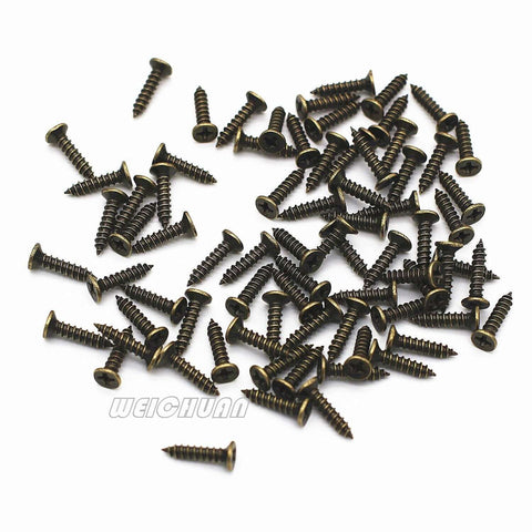 Antique Bronze Iron Drawer Knobs Pulls Handles Set For Cabinets And Wardrobes Vintage Shell Shape Three And Three Quarters Inch Length Nine Point Six Centimeters Twenty Piece Pack With Screws DIY Friendly, scattered screws visible.