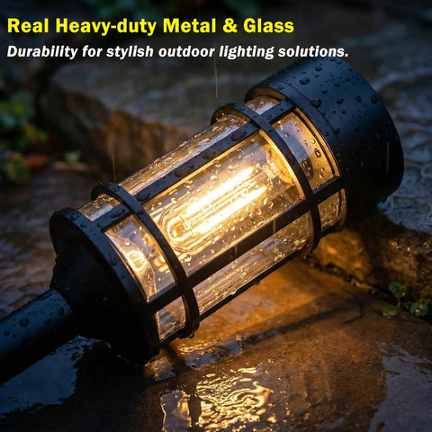 Close-up of Eight Pack Solar Pathway Lights Outdoor Waterproof 21 Inch Metal and Glass in rainy weather on stone path.