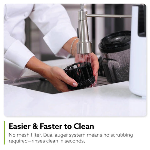 Hands rinsing Hurom H70 Cold Press Juicer components under faucet, demonstrating easy clean design.