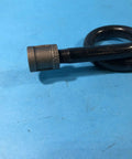 Close-up of siphon loop component of TBG16A 600R Steam Trap Assembly for P47 Series, black metal, on blue background.
