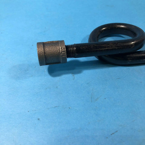 Close-up of siphon loop component of TBG16A 600R Steam Trap Assembly for P47 Series, black metal, on blue background.