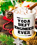Funny Engineer Mug For Men And Women A Totally Dope Graduation Gift For Engineers And Students And STEM Lovers Mechanical Civil Science And Math Coffee Cup Keepsake with 'Yoda Best Engineer Ever' text, filled with marshmallows, holiday decor.
