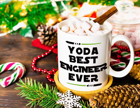 Funny Engineer Mug For Men And Women A Totally Dope Graduation Gift For Engineers And Students And STEM Lovers Mechanical Civil Science And Math Coffee Cup Keepsake with 'Yoda Best Engineer Ever' text, filled with marshmallows, holiday decor.