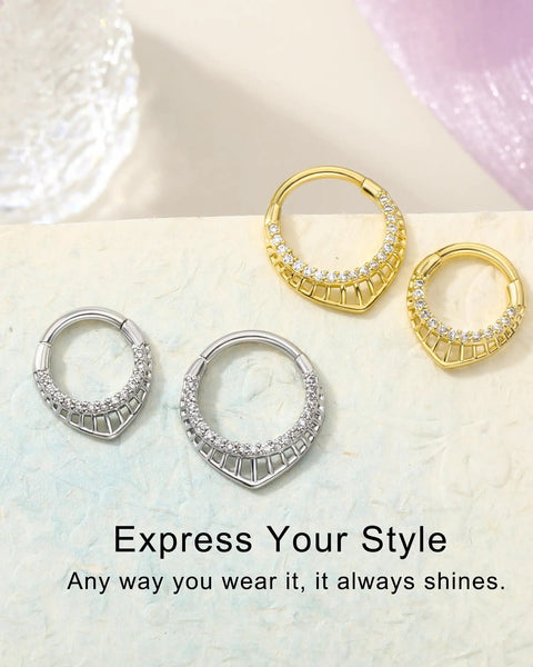 16G Teardrop Septum Ring With V-Shaped Openwork Bar And CZ Stones, 316L Surgical Steel Hinged Clicker Nose Ring For Women in silver and gold on a textured surface