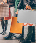 Rugged Aluminum Alloy Tool Case With Sturdy Carry Handle For Mechanics And Weekend Warriors, held among shopping bags.