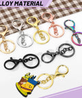 28Pcs 7 Color Lobster Claw Clasps With Key Chain And Flat Split Keychain Ring Set For Purses, Bags And DIY Crafts, Includes 68mm Clasp Length And 30mm Ring Diameter In Vibrant Colors displayed on fabric background.