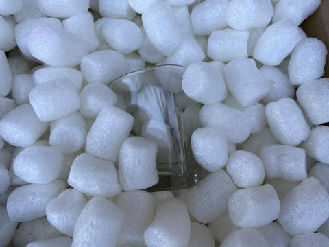 Biodegradable Packing Peanuts 0.25 Cu Ft Antistatic, Compostable White Popcorn Packaging Cornstarch Blend cushioning a glass