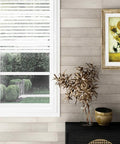 Living room with Real Wood Shiplap Wall Planks White 5 Inch Peel And Stick Boards Set Of 10 12.5 Sq Ft accent wall, window view.