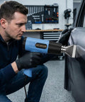 Man using Heat Gun With Dual Temperature 572 To 1112 Fahrenheit, Two Speed, 110 Volt, on car wrap application, blue tool
