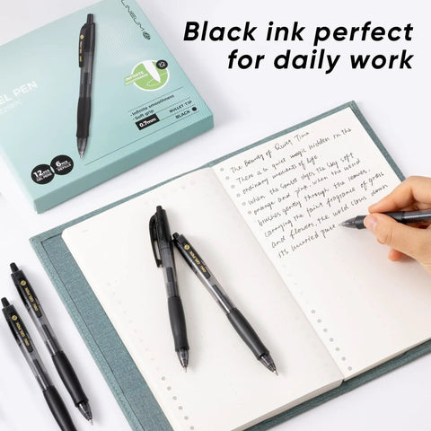 Hands writing in notebook with Bulk Gel Pens 0.7mm Retractable Black Ink Set 12 Pens With 6 Refills Long Lasting Value visible nearby