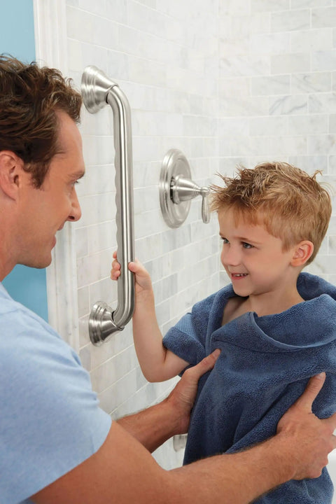 Man helping child near 24 Inch Handicap Grab Bar For Bath And Shower With Curled Grip No Slip Brushed Nickel Heavy Duty Stainless Steel