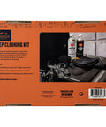 Box of Heavy Duty Grill Cleaning Kit with exterior spray, degreaser, microfiber towels, nitrile gloves on a grill surface