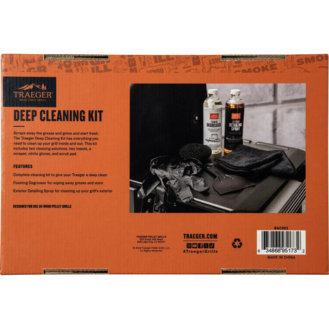 Box of Heavy Duty Grill Cleaning Kit with exterior spray, degreaser, microfiber towels, nitrile gloves on a grill surface
