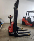 Built Tough Electric Pallet Stacker Packing 2600 Lbs Capacity Boasting Quick 118 Inch Lift Height with red and black design.