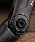 Close-up of adjustable riser handlebar stem for mountain and road bikes, showing 0 to 90 degree tilt adjustment. Forged alloy construction, 110mm extension.