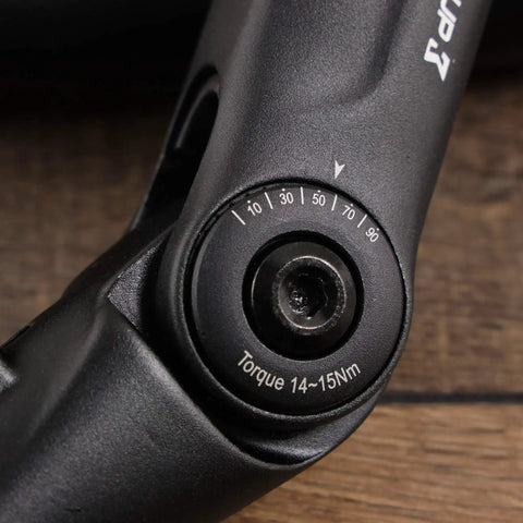 Close-up of adjustable riser handlebar stem for mountain and road bikes, showing 0 to 90 degree tilt adjustment. Forged alloy construction, 110mm extension.
