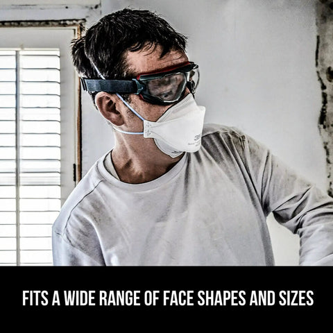 Person wearing Particulate N95 Respirator 9205 Flat Fold Lightweight Non Valved, fitting with safety goggles during renovation.