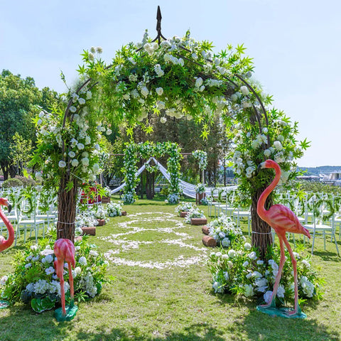 Metal Garden Arch Wedding Arbor With Gothic Spires 9.5 Ft High 4.1 Ft Wide Pergola adorned with flowers for outdoor ceremony