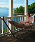 Two Person Luxury Hammock With Steel Stand Portable 450 Lbs Capacity Cotton Blend 60 Inch Bed on a wood deck by a lake