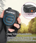 Hand holding Beefy Handheld Ham Radio Microphone With IP54 Waterproof Rugged Speaker Mic in outdoor setting, showing volume control.