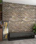 Peel And Stick Faux Brick 3D Wall Panels 10 Pack 52.5 Sq Ft in Gray Brown installed on living room wall with modern furniture.