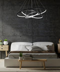 Bedroom with Dope Three Ring Pendant Chandelier for Living Room and Dining Room, modern circle ceiling light in black finish.
