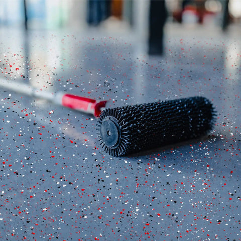 Epoxy Floor Decorative Flakes Kit 2.4 Kg 5.3 Lb Red Black White Blend 5-8 Mm Chips on garage floor with rolling tool