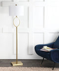 61 Inch Brass Gold Metal LED Floor Lamp With Hoop Design next to blue chair