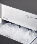 Genuine Game Changing Nugget Ice Maker With Smart Wifi App And Built In Scale Fighting Filter Makes Hella Crisp Chewable Pellet Ice Fast Comes With Handy Scoop Sleek Stainless Build with crushed ice at front.