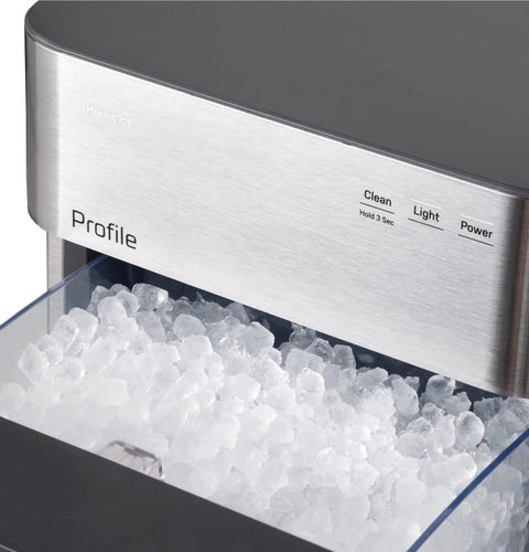 Genuine Game Changing Nugget Ice Maker With Smart Wifi App And Built In Scale Fighting Filter Makes Hella Crisp Chewable Pellet Ice Fast Comes With Handy Scoop Sleek Stainless Build with crushed ice at front.