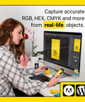 Woman using Portable Color Sensor And Color Matcher Tool With 300000 Plus Paint Library at computer desk.