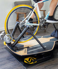 Indoor Trainer Tire for Road Bikes 700x25c Yellow, Ultra Quiet and Durable on a bike in a home spin session.