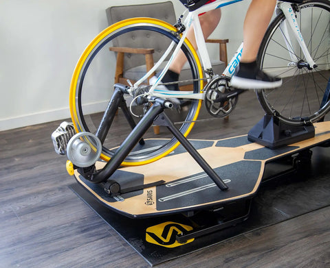 Indoor Trainer Tire for Road Bikes 700x25c Yellow, Ultra Quiet and Durable on a bike in a home spin session.
