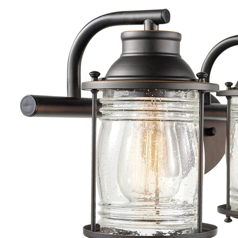 Close-up of oil rubbed bronze vanity fixture with seeded glass shade, part of All In One Bathroom Set With Oil Rubbed Bronze 3 Light Vanity Fixture, Towel Bar And Ring, Robe Hook And Toilet Paper Holder, Seeded Glass Shades, Modern Coastal Style.