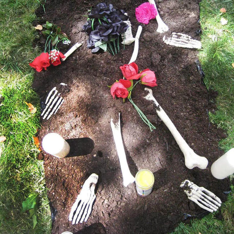 Life Size Skeleton Bone Set For Halloween Decor In A Mesh Bag 28 piece spooky graveyard skeletons with flowers and candles