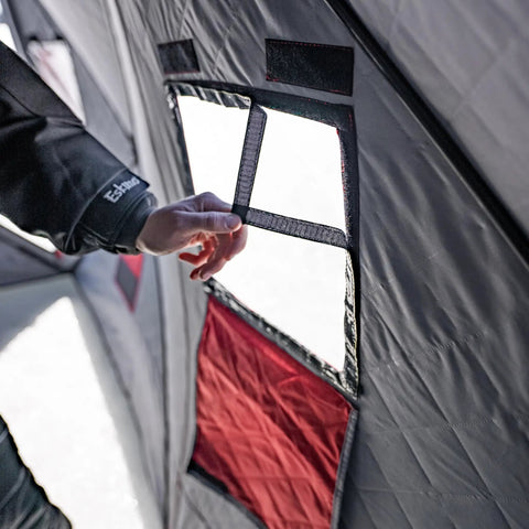 Quickfish Six Person Portable Pop Up Ice Fishing Shelter With Fully Quilted Insulation No Trip Door and Deluxe Anchors For Hell Of A Winter Setup In Red Black, showing interior window detail.