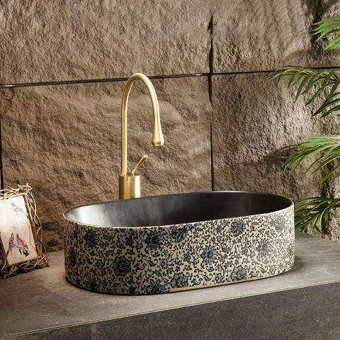 Retro Ceramic Vessel Sink for Bathroom, Oval Above-Counter Wash Vanity Sink with Accessories against stone backdrop.