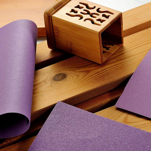 600 Grit Wet Dry Sanding Sheets 9 by 11 Inch Set with white fused alumina on wooden surface with bamboo box