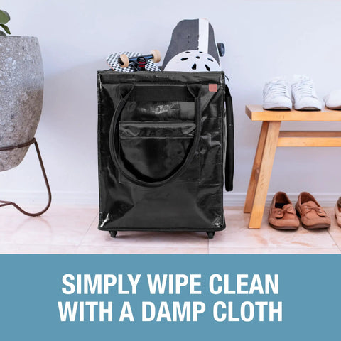 90L Collapsible Rolling Tote With Wheels For Groceries And Laundry, shown parked beside shoes and a skateboard