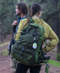 Rechargeable Camping Light With Clip Hook attached to green backpack during outdoor adventure