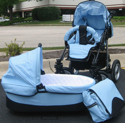 Light blue baby stroller set with carriage, seat, and matching diaper bag, parked outdoors on asphalt surface.