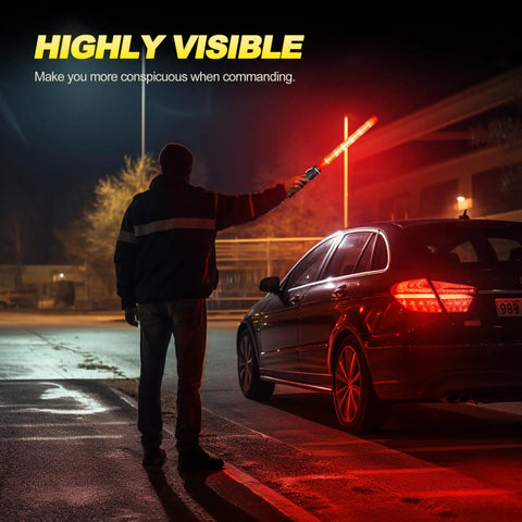 Person guiding car with 6-Piece 21-Inch Traffic Control Wand With 3 Flashing Modes Safety Baton Light, night scene.