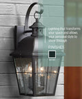 Classic Millhouse 18.5 Inch Outdoor Wall Lantern in Mystic Black with Clear Seeded Glass on a brick wall