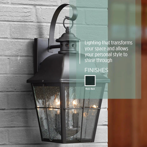 Classic Millhouse 18.5 Inch Outdoor Wall Lantern in Mystic Black with Clear Seeded Glass on a brick wall